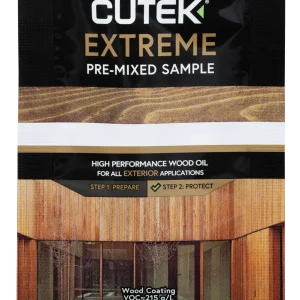 Close-up of Cutek Extreme wood oil sachet with 'Pre-Mixed Sample' label against a wood-grain background