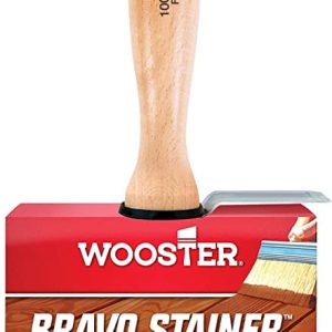 Wooden-handled 4-inch bristle stain brush resting on a red Wooster Bravo Stainer box, for applying oil-based stains and sealers.